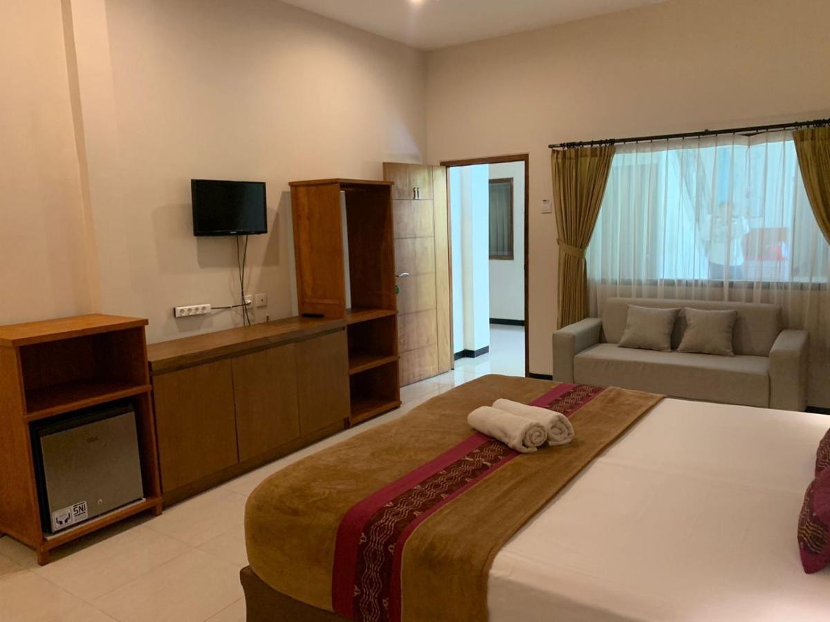 Kuta Suci Guest House Extérieur photo