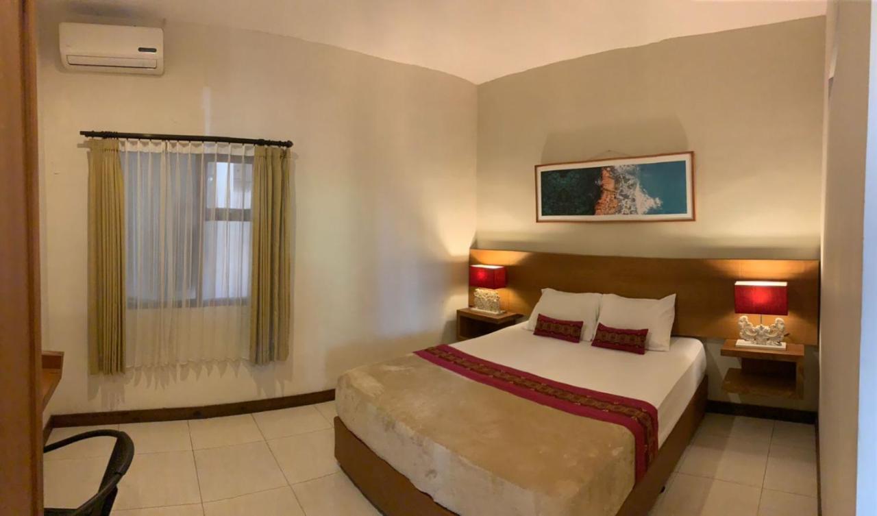 Kuta Suci Guest House Extérieur photo