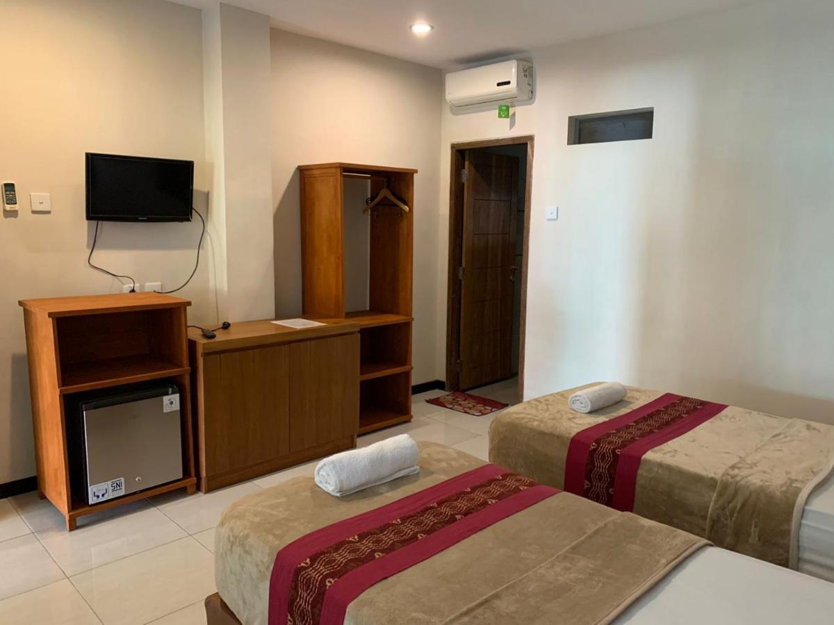 Kuta Suci Guest House Extérieur photo
