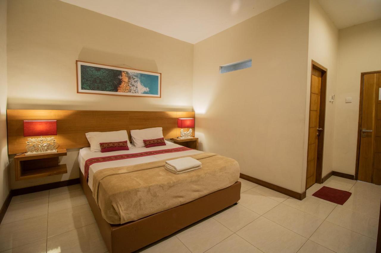 Kuta Suci Guest House Extérieur photo