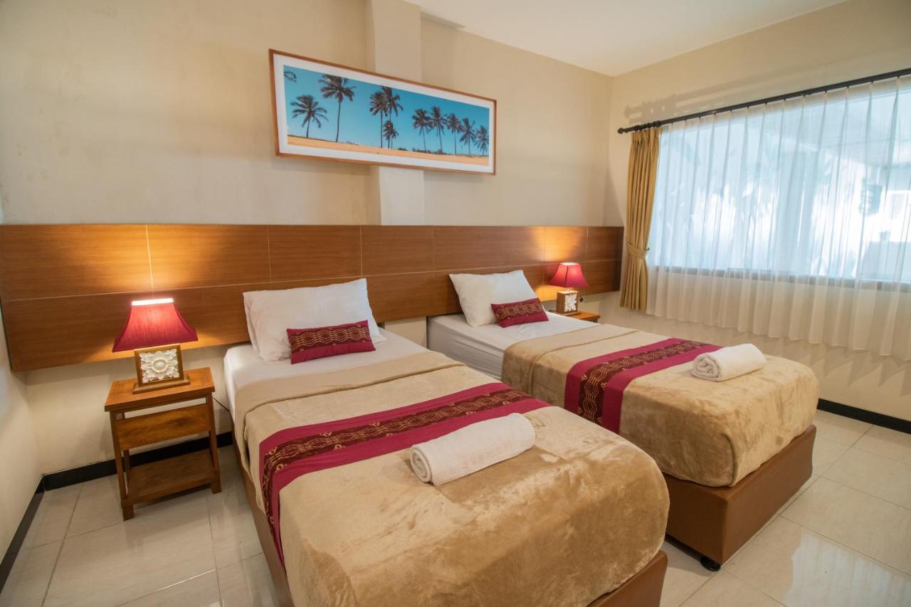 Kuta Suci Guest House Extérieur photo