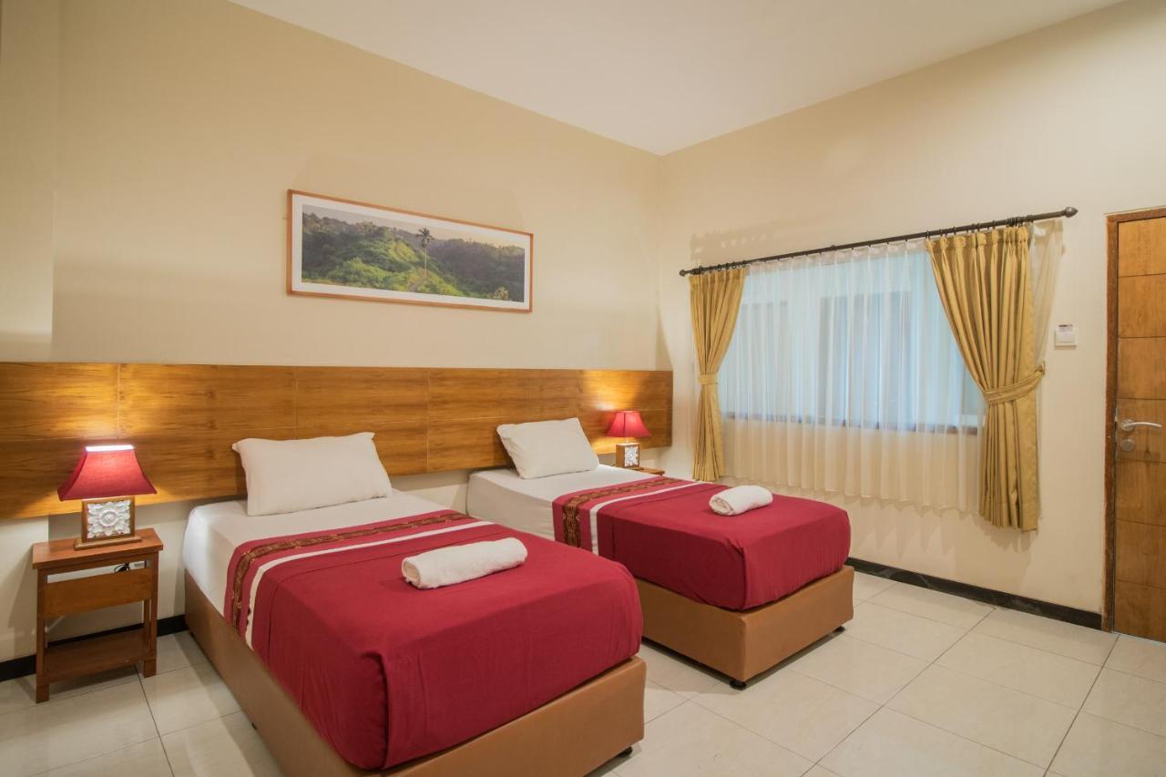 Kuta Suci Guest House Extérieur photo