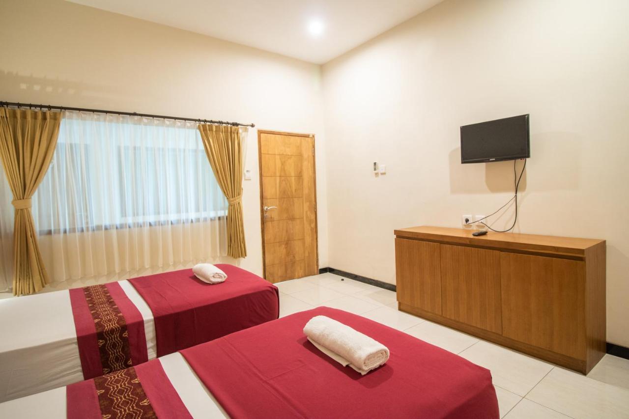 Kuta Suci Guest House Extérieur photo