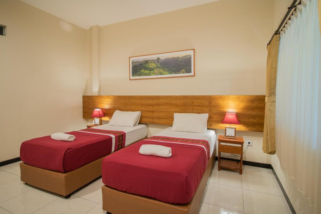 Kuta Suci Guest House Extérieur photo