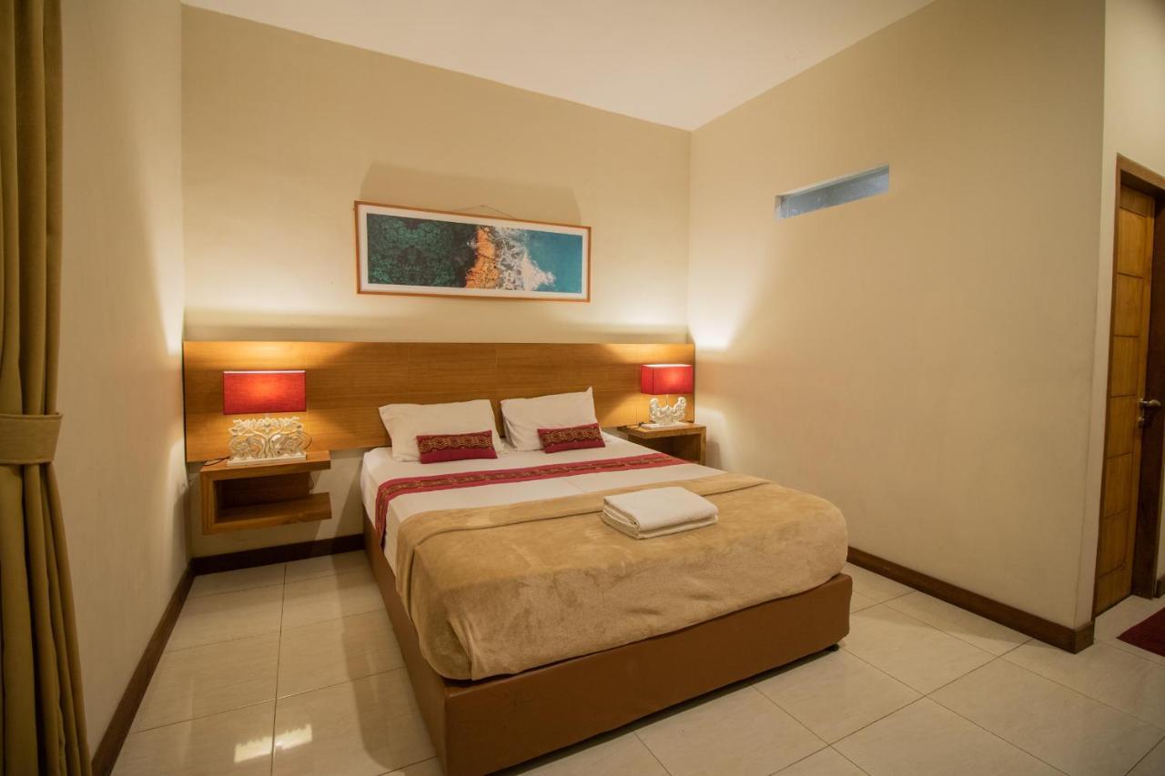 Kuta Suci Guest House Extérieur photo
