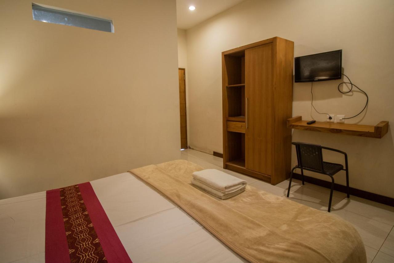 Kuta Suci Guest House Extérieur photo
