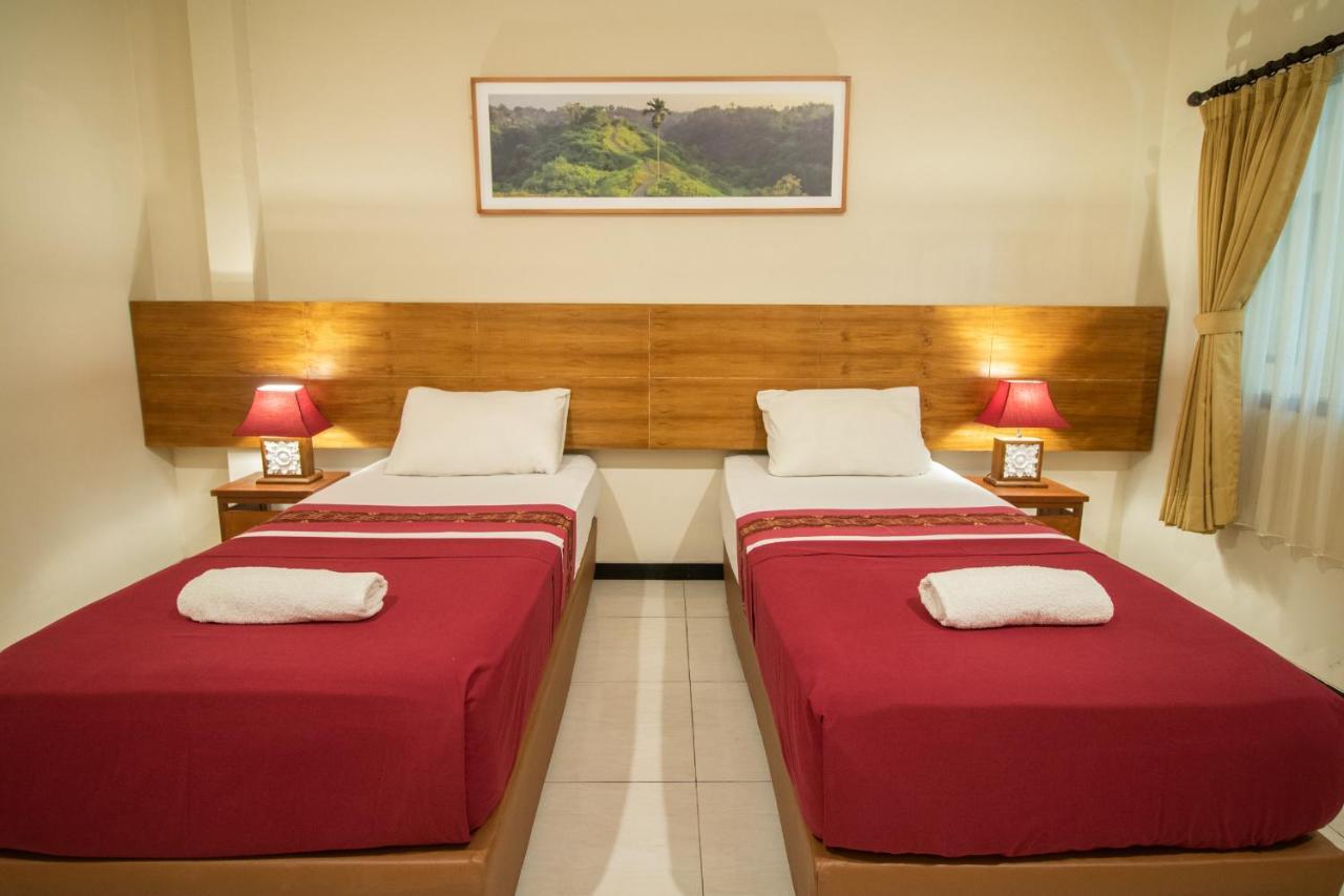 Kuta Suci Guest House Extérieur photo