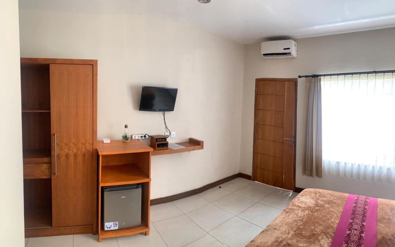 Kuta Suci Guest House Extérieur photo