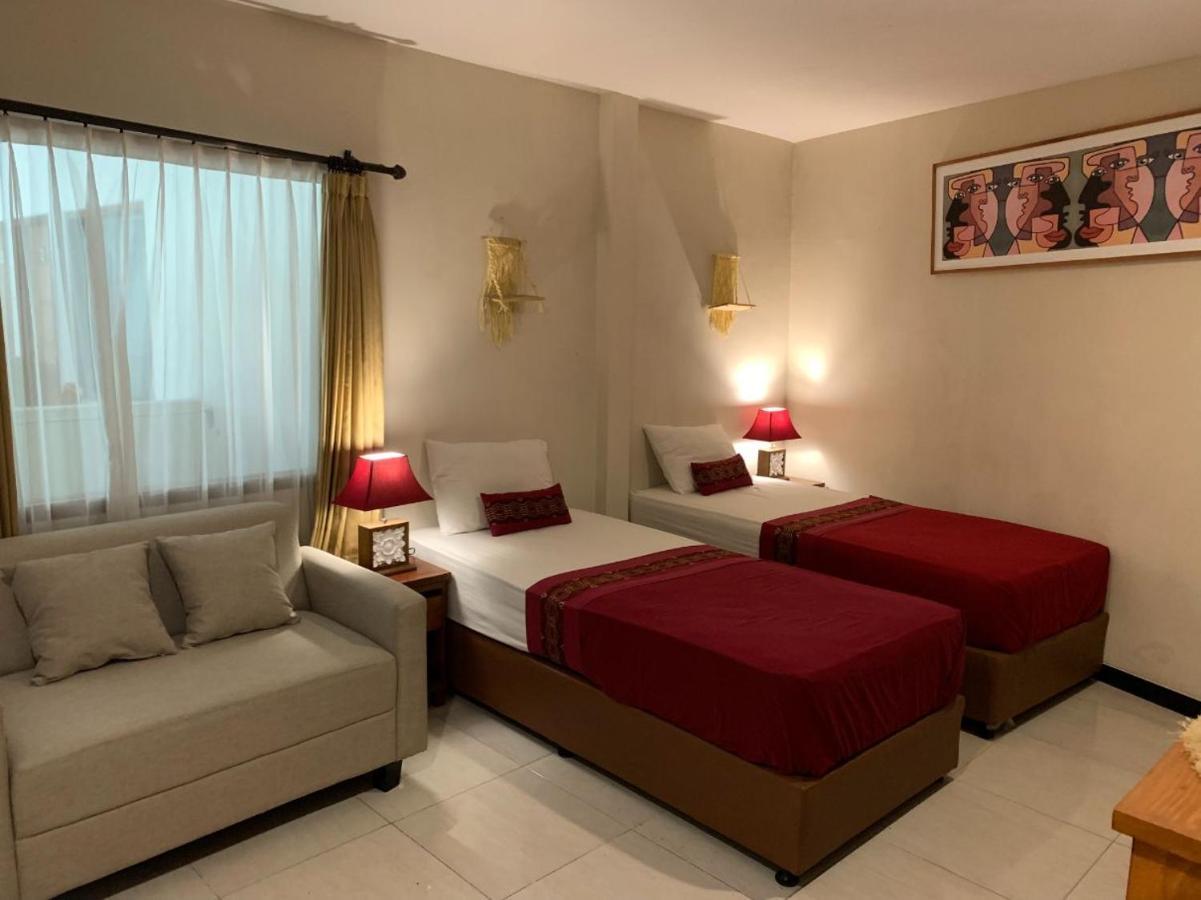 Kuta Suci Guest House Extérieur photo