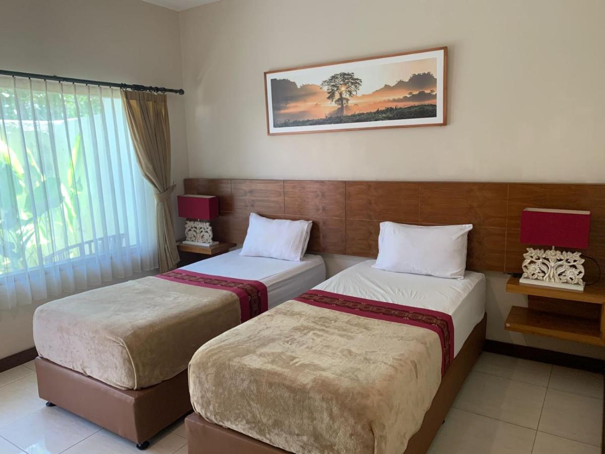 Kuta Suci Guest House Extérieur photo