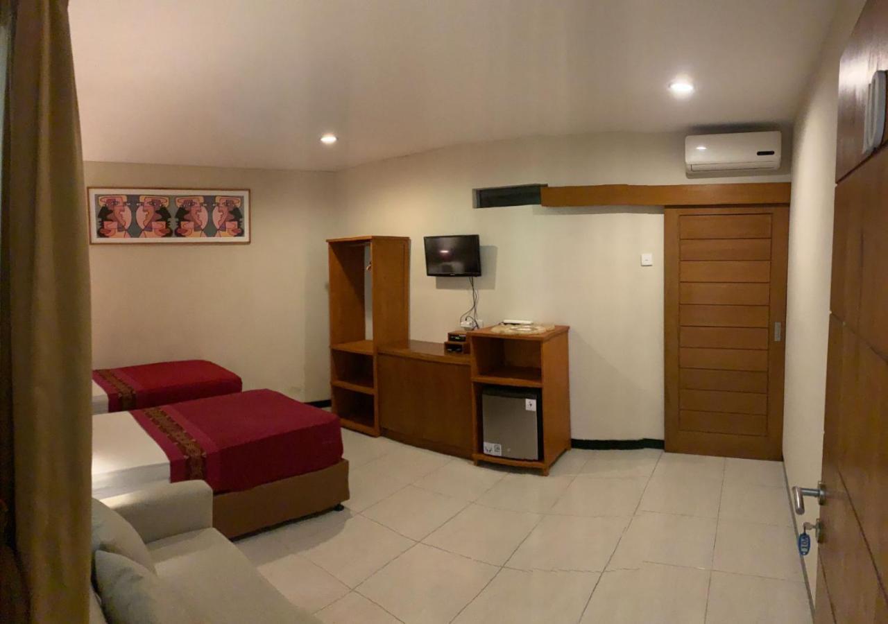 Kuta Suci Guest House Extérieur photo