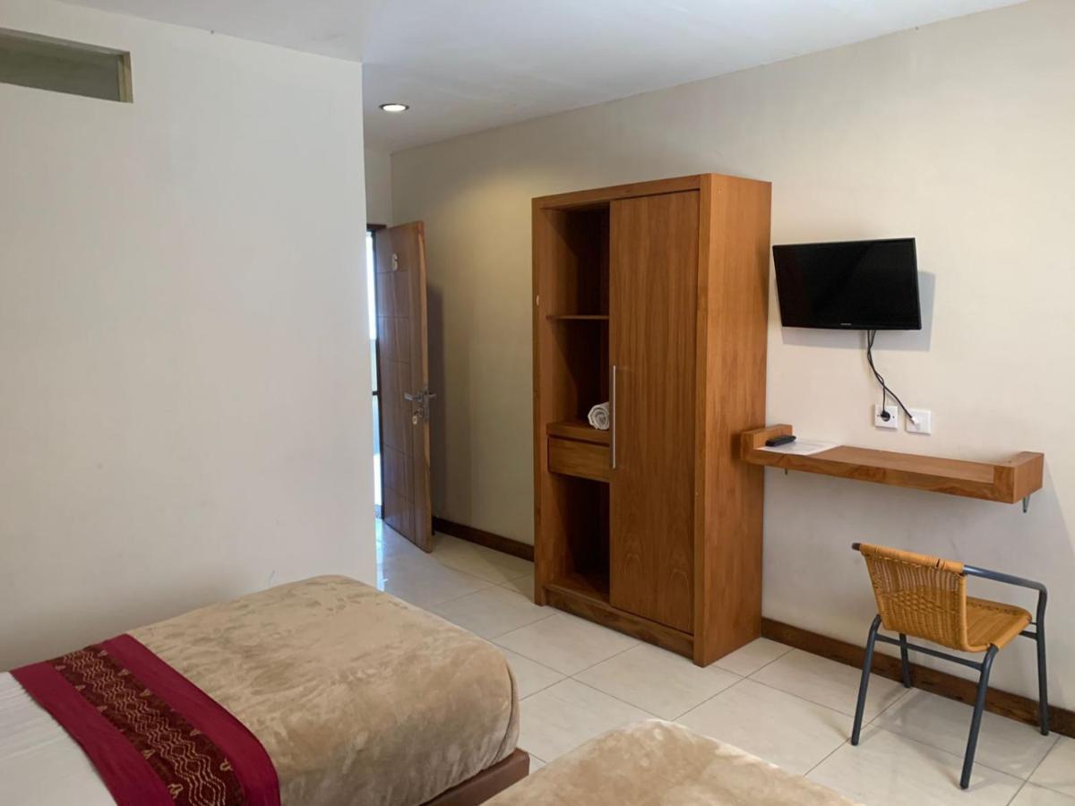 Kuta Suci Guest House Extérieur photo