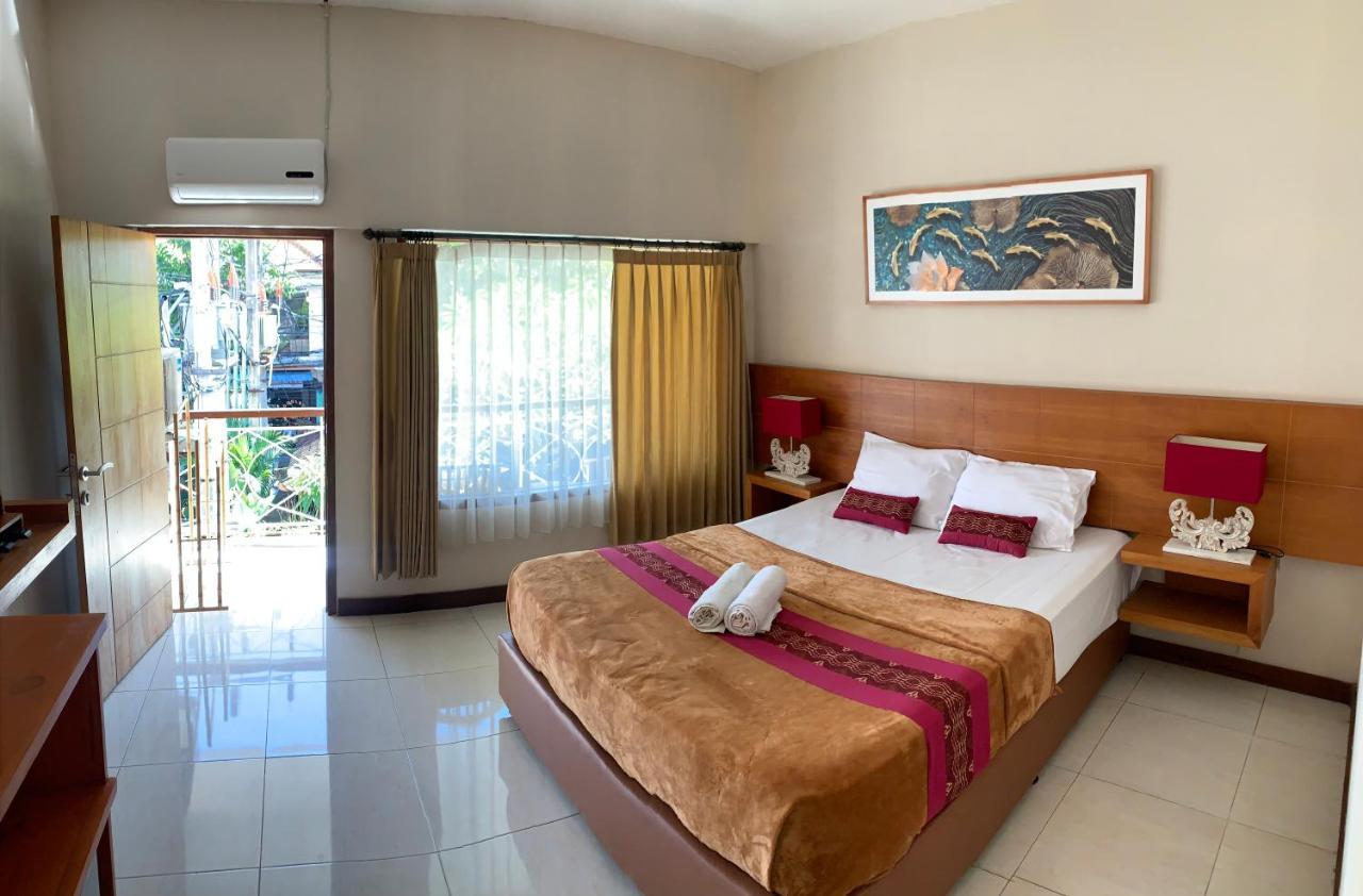 Kuta Suci Guest House Extérieur photo