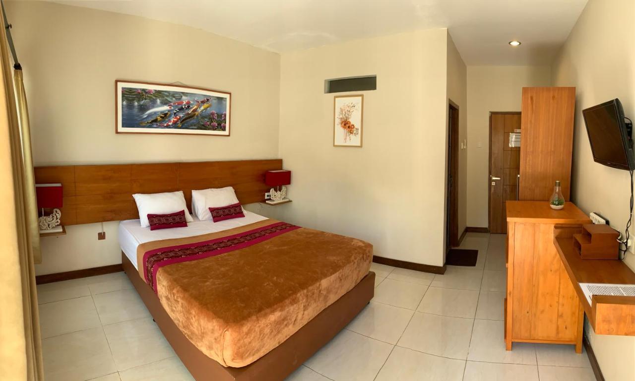 Kuta Suci Guest House Extérieur photo