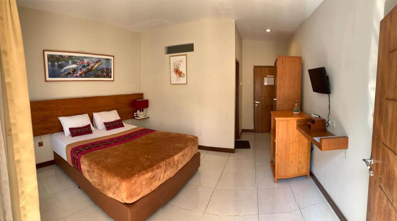 Kuta Suci Guest House Extérieur photo