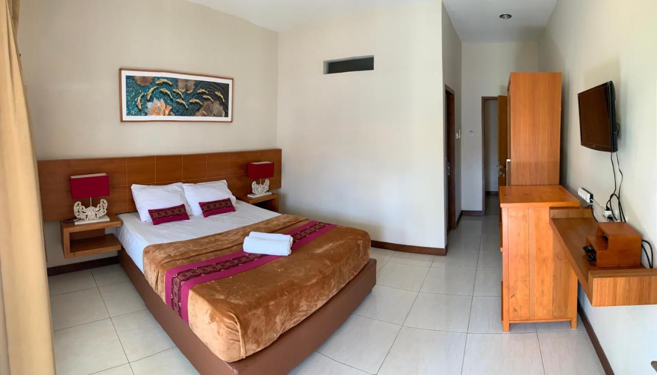 Kuta Suci Guest House Extérieur photo