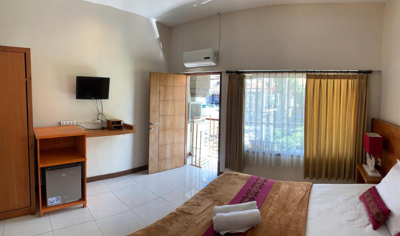 Kuta Suci Guest House Extérieur photo
